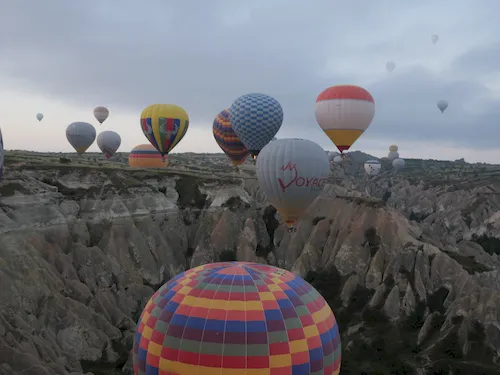 Turkey, Cappadocia - Balloons above Cappadocia's unique rock formations