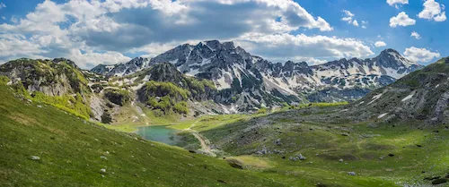 Montenegro - Mountain lake in Durmitor National Park with glacier lake and reflecting mountains