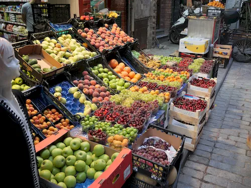 Turkey, Istanbul - Fresh fruit displayed in wooden crates at the Grand Bazaar