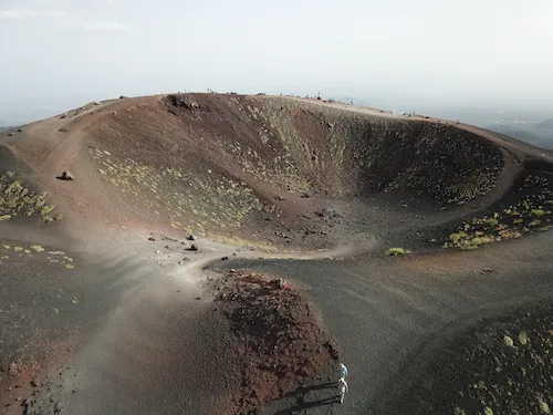 Italy, Sicily - Mount Etna rising above the volcanic landscape