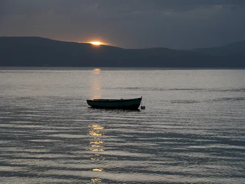 Macedonia, Lake Ohrid - Fishing boat at sunset