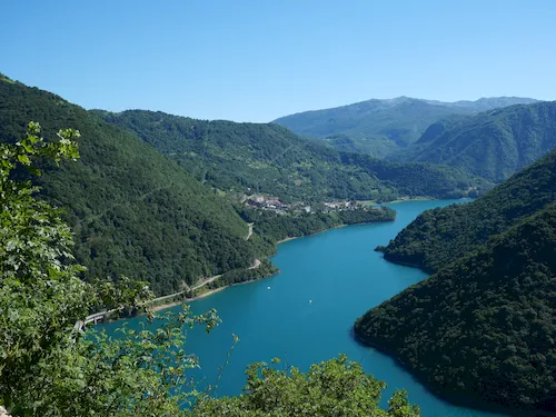 Scenic view of Lake Piva with green mountains
