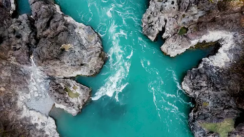 Mountain turquoise river with rocky banks