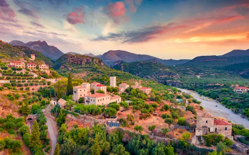 Greece, Kardamyli - Breathtaking summer view of Mourtzinos Tower at sunset on the Mani Peninsula