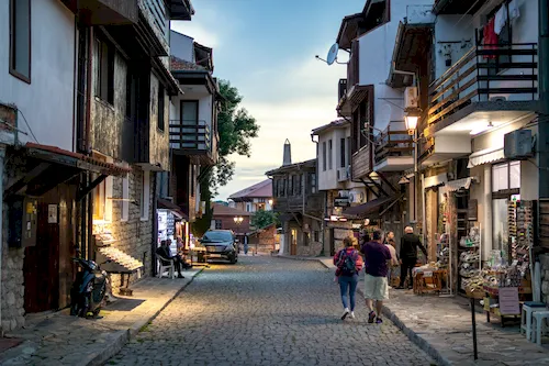 Bulgaria, Nessebar - Narrow cobblestone street and antique architecture in the old historic town on the Black Sea coast
