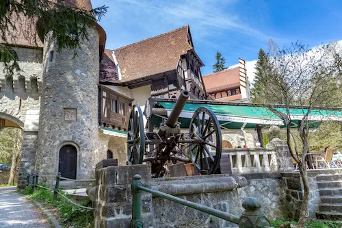 Romania, Sinaia - Old cannon at the gate of the Royal Peles Castle