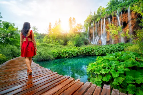 Croatia, Plitvice Lakes National Park - Wooden path with lakes and waterfalls. UNESCO Natural World Heritage and famous travel destination