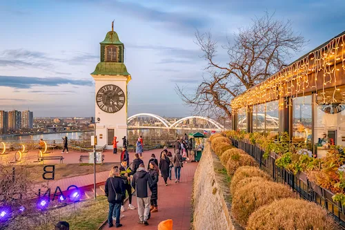 Serbia, Novi Sad - Sunset over Novi Sad with the iconic clock tower of Petrovaradin Fortress